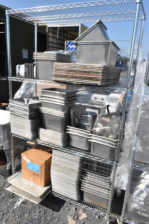 Chrome 4-tier wire shelving with stainless steel bins and baking pans. Buyer must dismantle; freight charges apply.