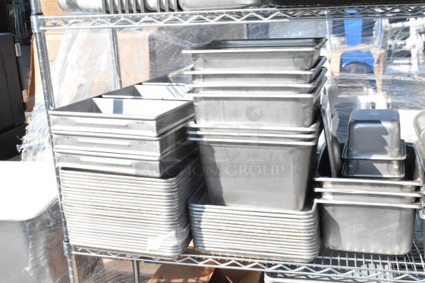 Chrome finish 4-tier wire shelving unit with stainless steel bins and baking pans. Buyer must dismantle.