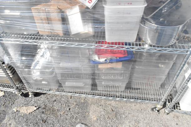Chrome 4-tier wire shelving unit with poly bins and ingredient bins, contents included. Buyer must dismantle.
