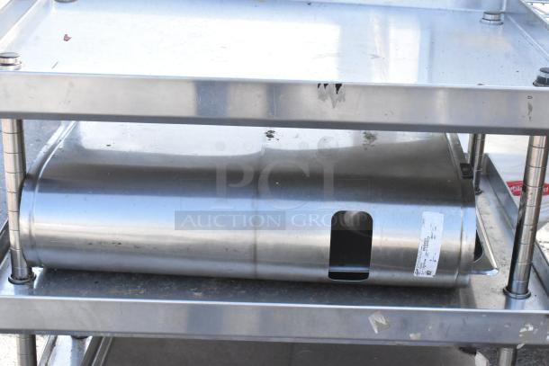 Stainless steel 3-tier stand with two iced tea holder dispensers. Shows minor wear and a visible label on the middle tier.