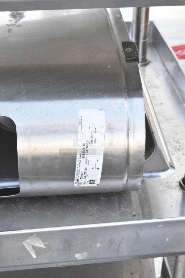 Stainless steel 3-tier stand with iced tea holder dispensers, visible label with product details, in used condition.