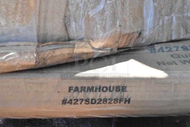 Cardboard boxes labeled "FARMHOUSE #427SD2828FH" with visible wear, containing scratch and dent items.