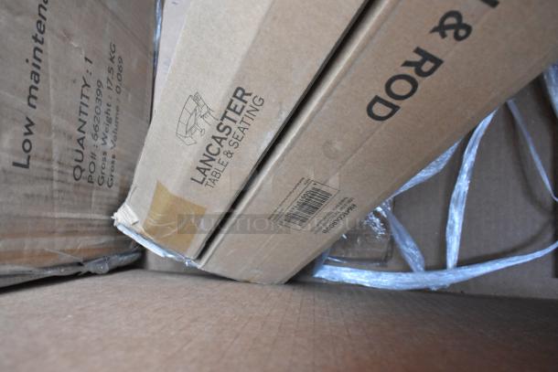 Cardboard boxes labeled “Lancaster Table & Seating,” containing 12 new scratch and dent items, visible inside packaging.