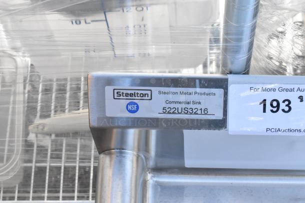 Brand new Steelton 522US3216 32"x16" utility sink with single-inlet faucet setup. Minor scratches. NSF certified label visible.