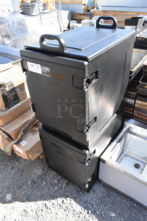 Black poly insulated food carrying catering cases, brand new, scratch and dent condition, with sturdy handles.