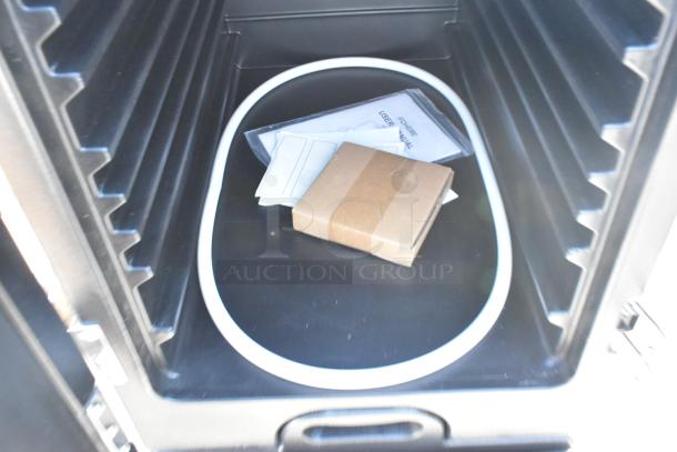Black poly insulated catering case, new condition, showing interior with user manual and gasket. Scratch and dent special.