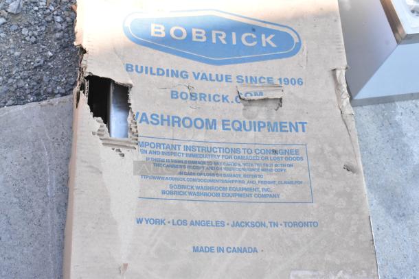 BRAND NEW SCRATCH AND DENT Bobrick B-3961 ClassicSeries paper towel dispenser/trash can in damaged box; visible branding.