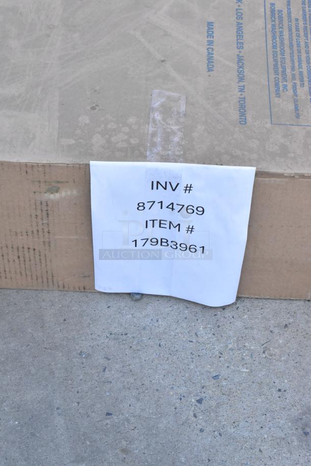 Brand new Bobrick B-3961 recessed paper towel dispenser in box, marked with "INV #8714769 ITEM #179B3961". Scratch and dent condition.