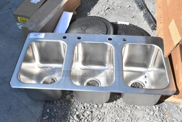 Brand new stainless steel commercial 3 bay drop-in sink, scratch and dent condition, with visible tag.