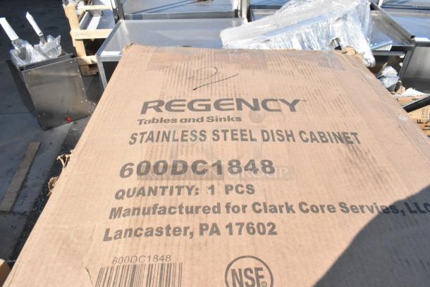 Box labeled "Regency Stainless Steel Dish Cabinet 600DC1848" shows scratch and dent condition; manufactured for Clark Core Services, Lancaster, PA.