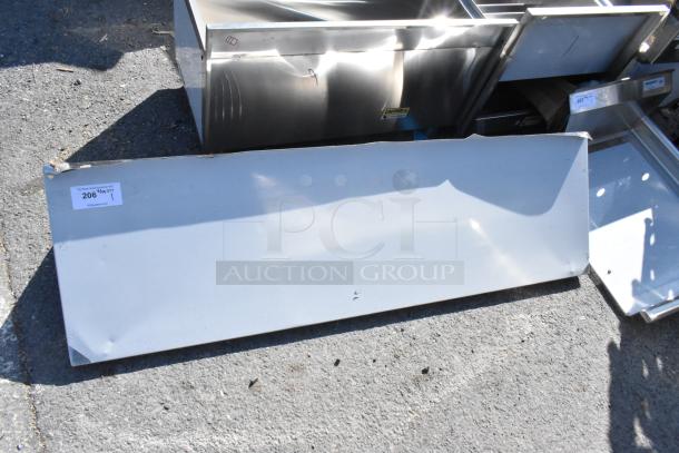 BRAND NEW Stainless Steel Wall Mount Shelf with Pot Rack, scratch and dent condition, auction tag reads "206."