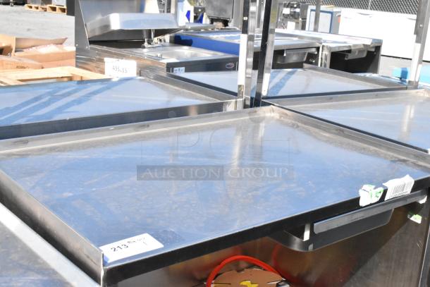 Stainless steel cart with under shelf, commercial casters, label 213, slightly used condition, visible surface wear.