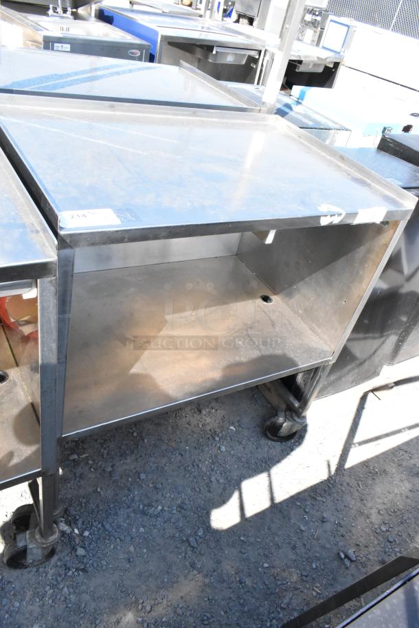 Stainless steel cart with under shelf, on commercial casters. Slightly used, durable, ideal for kitchen or workshop.