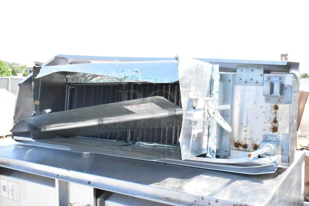 CaptiveAire 4830 ND-2 stainless steel commercial grease hood with make-up air vent, showing visible damage and rust.