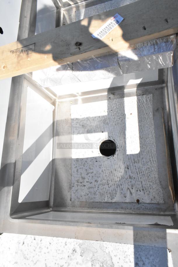 Brand new Elkay 1-32126X24-2-24 stainless steel 3 bay sink with dual drain boards in crate, no legs shown.