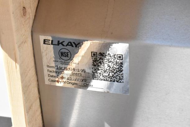 NSF label on new Elkay 1-32126X24-2-24 stainless steel 3-bay sink. No legs. Made in China. Factory ID: 31673.