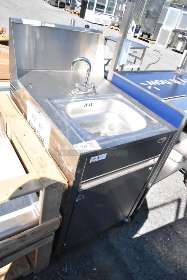 QualServ stainless steel commercial portable sink with single bay, faucet, and commercial casters. In good condition.
