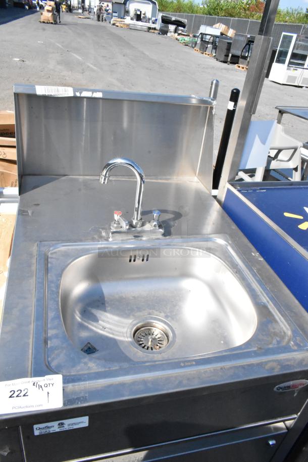 QualServ stainless steel portable single bay sink on casters, featuring faucet and backsplash, minor surface wear visible.