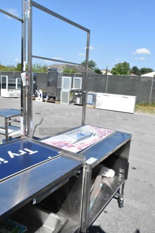 Stainless steel cart with under shelf on commercial casters, featuring a spacious top surface. Ideal for versatile use.