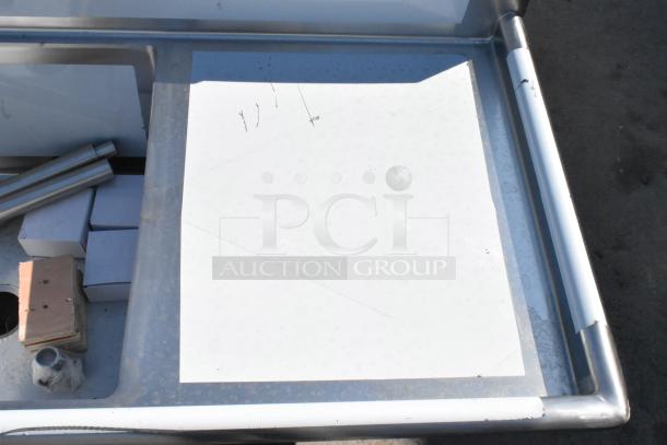 Regency 124" commercial sink, stainless steel, three compartments, two drainboards; scratch marked, some packaging visible.