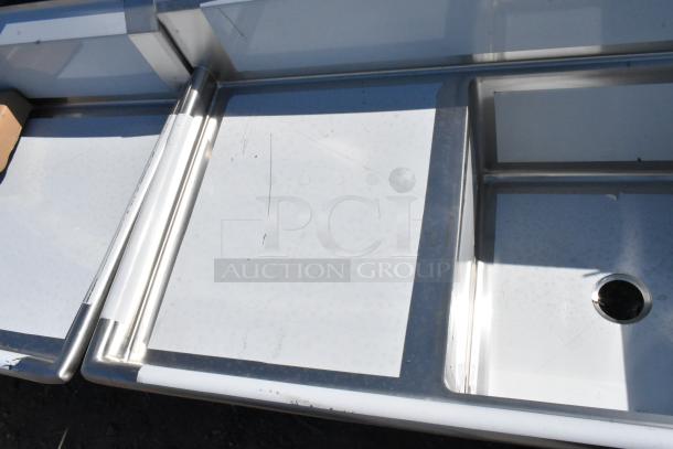 BRAND NEW SCRATCH AND DENT Regency 600S3242424S stainless steel commercial sink with three 24"x24"x14" bowls and two drainboards.