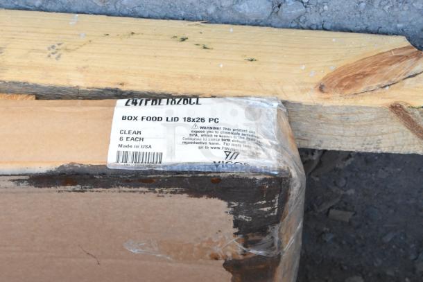 Cardboard box labeled "Box Food Lid 18x26 PC, Clear, 6 Each, Made in USA." Labeled as scratch and dent item.