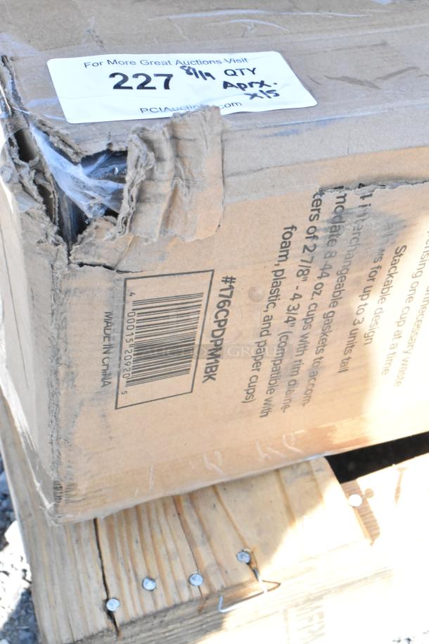 Damaged cardboard box labeled "Made in China" containing items like trash can dolly, wine glasses, storage containers. Quantity: 15.