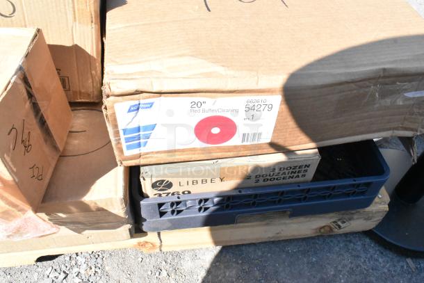 Cardboard boxes on a pallet with "20-inch Red Buffer/Cleaning" label by Norton and Libbey wine glasses box visible.