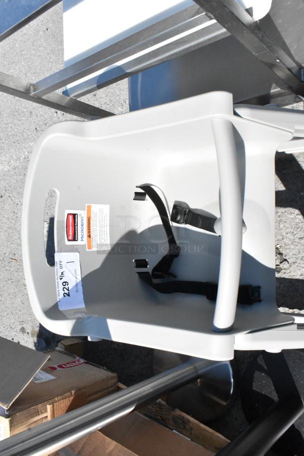 Rubbermaid FG780508PLAT Platinum high chair with wheels, brand new with minor scratches, equipped with a safety harness.