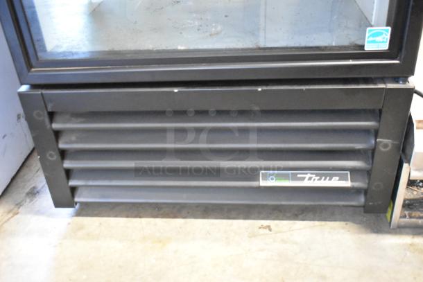 2023 True GDM-26-HC single door cooler, metal exterior, poly-coated racks, 115V, 1 Phase. Brand label visible.