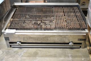 Anvil stainless steel commercial gas charbroiler grill, countertop model, dual control knobs, visible moderate use.