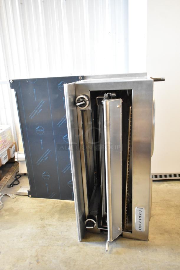 Garland stainless steel commercial salamander cheese melter, natural gas powered, with backsplash, excellent condition.