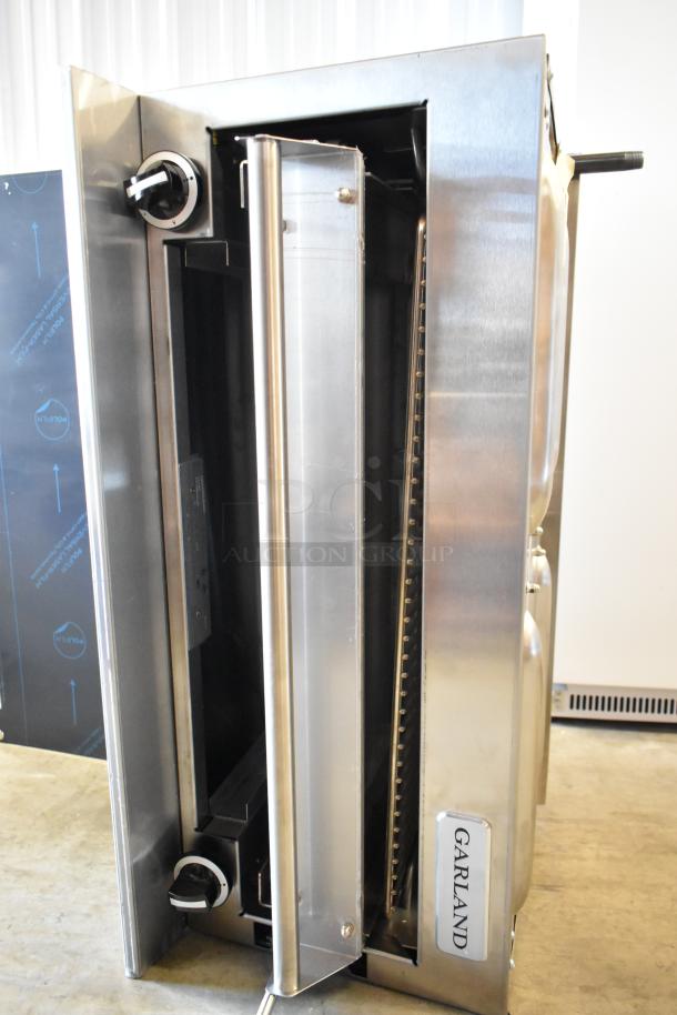 Garland stainless steel commercial salamander cheese melter with backsplash; natural gas powered, silver finish, excellent condition.