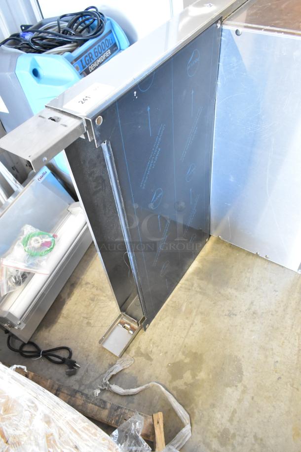 Garland stainless steel commercial salamander cheese melter with back splash, natural gas powered, new condition.