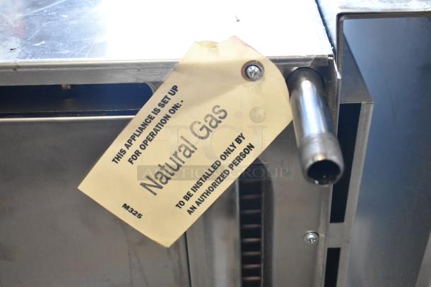 Garland stainless steel natural gas salamander cheese melter with back splash, tag shows "Natural Gas" setup, model M325.