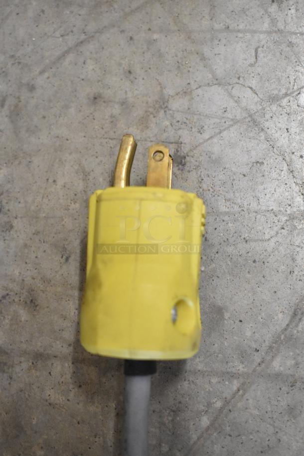 Yellow power plug of 2020 Bizerba GSP H Meat Slicer, 120V, 1 Phase. Used condition, visible wear on prongs.