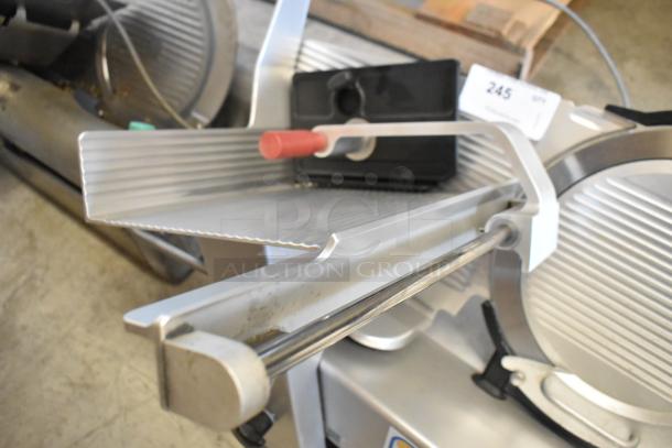 2016 Bizerba GSP H metal commercial meat slicer, countertop model, 120V, 1 phase, slicer with red handle, includes label showing model.