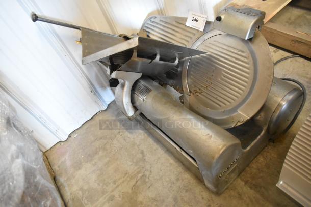 Hobart 1612E metal commercial countertop meat slicer with blade sharpener, 120V, 1 phase, showing cosmetic wear.