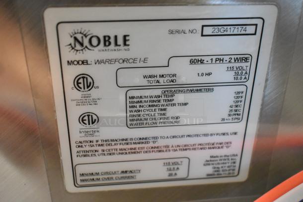 Stainless steel Noble Wareforce I-E dish machine, 115V, new with minor scratches. Label shows model and operating parameters.