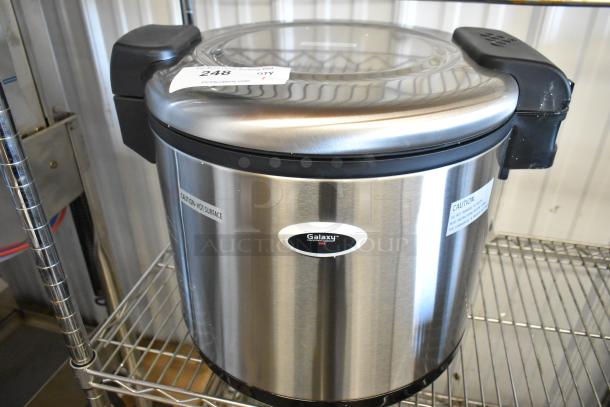 Brand new Galaxy 177RWG90 90-cup electric rice warmer, scratch and dent, 120 volts, 1 phase, stainless finish, "Caution: Hot Surface" label.