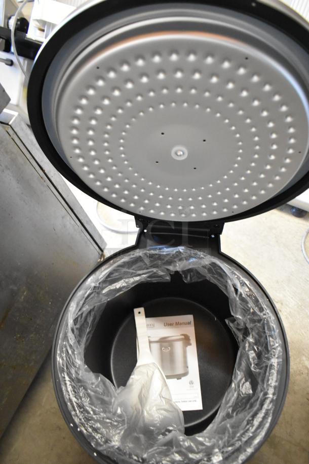 BRAND NEW SCRATCH AND DENT! 2023 Galaxy 177RWG90 90 Cup Electric Rice Warmer open, showing interior and user manual.