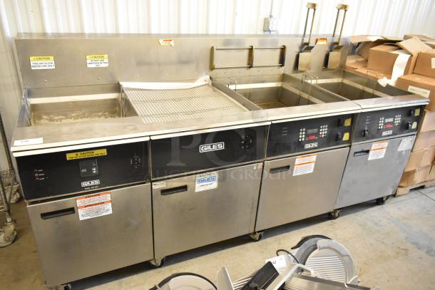 Giles EOF stainless steel commercial electric 3-bay deep fat fryer with dumping station, on casters, 480 volts, with caution labels.