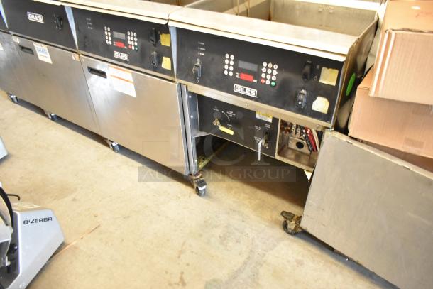 Giles EOF stainless steel commercial electric 3-bay deep fat fryer with dumping station, on casters, 480 volts, used condition.