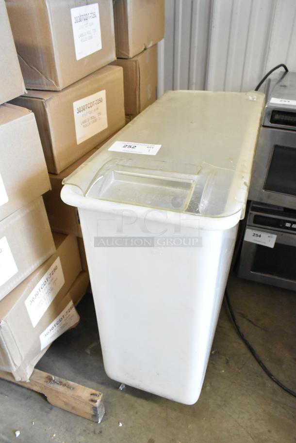 White poly ingredient bin on commercial casters, durable, with lid, used condition, ideal for kitchen storage.