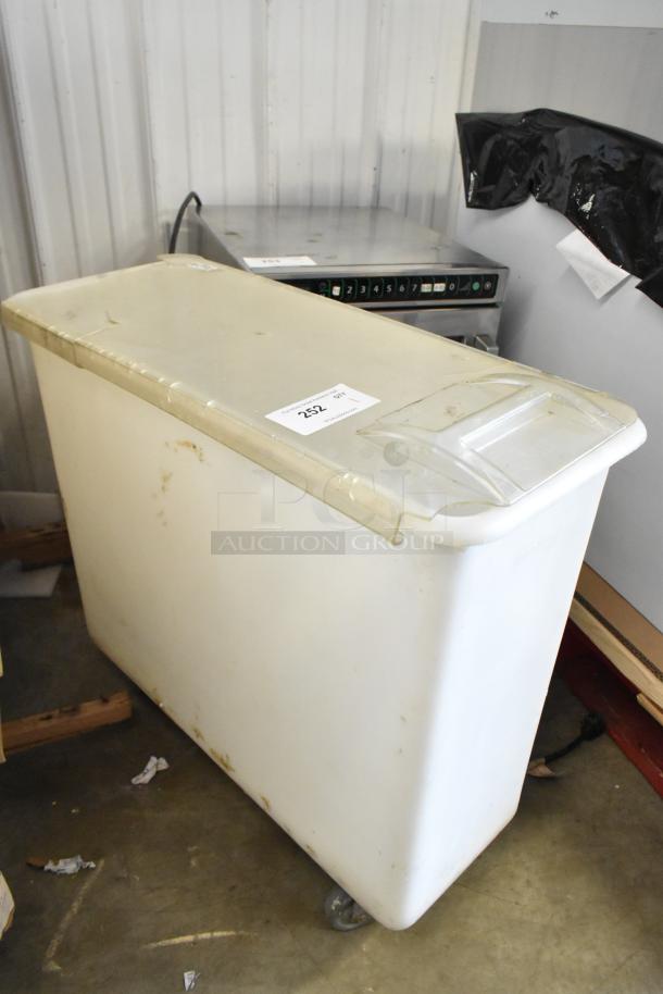 White poly ingredient bin on commercial casters, used condition, with item tag labeled "252".