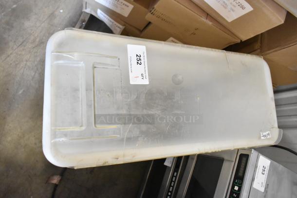 White poly ingredient bin on commercial casters, showing surface wear. Label marked "252." Perfect for storage use.