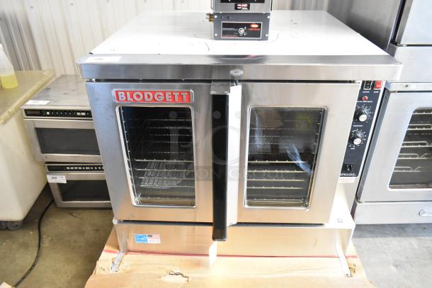 Brand new Blodgett Zephaire-200-E stainless steel electric convection oven with glass doors, metal racks, and controls.
