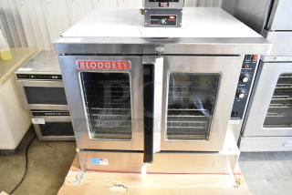 Brand new Blodgett Zephaire-200-E stainless steel electric convection oven with glass doors, metal racks, and controls.