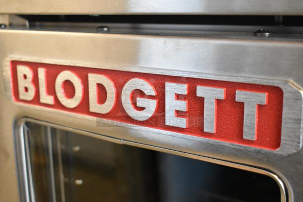 New Blodgett Zephaire-200-E stainless steel electric convection oven, view-through doors, metal racks. 208V, 3 phase.
