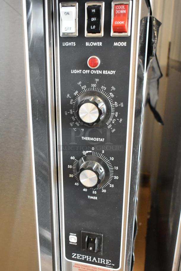 Stainless steel Blodgett Zephaire-200-E convection oven controls, with thermostatic dials and mode switches visible.